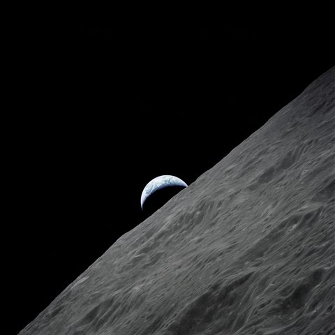 Crescent Earth rises above the lunar horizon by NASA — large framed print