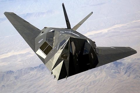 F-117 over the desert by USAF / Aaron Allmon II — large framed print