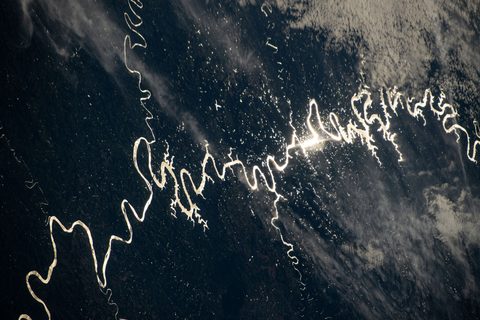 Sun glint on a South American river by NASA / Don Pettit — large framed print