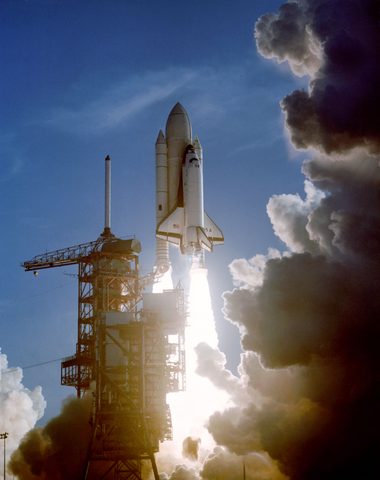 Columbia STS-1 climbs past the tower by NASA — large framed print